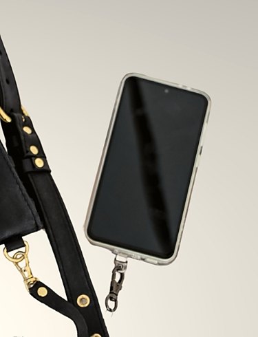 The retractable tether clipped to a phone case